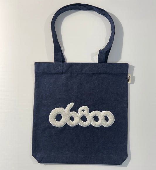 TOTE BAG DENIM CON TELA DE BORREGUITO CRUDO BORDADO