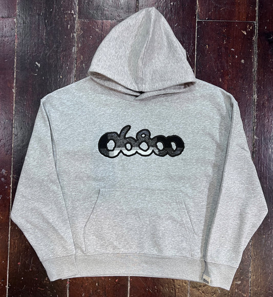 SUDADERA GRIS CON TELA A CUADROS BLANCO Y NEGRO BORDADO